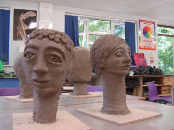 sculptured heads in clay