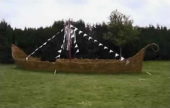 photos of a life sized viking ship and hut made from willow